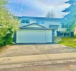 Executive Renovated 5 bed. BILEVEL with double front garage and RV parking pad.