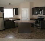 Rent-to-Own 1 Bedroom + Den Luxurious 12-plex village home in Panorama Hills