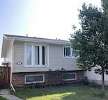 Bright Main Floor Bungalow Steps from Fish Creek | Quiet Deer Run Cul-de-Sac
