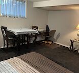 Furnished Basement Suite. Sept 1st. Woodbine SW. own entrance, shared laundry.