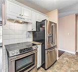 Prime location! Bright 2 bedroom condo across from park with covered parking!
