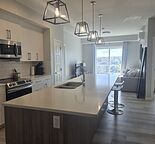 TOP floor WEST facing CONDO: 2 Bed, 2 Bath, 2 PRKG stalls, A/C, Insuite Laundry.
