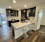 Furnished 1 bedroom Upper level suite in Livingston NW Calgary, side entrance