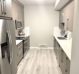 Furnished one bedroom legal suite with private side entrance