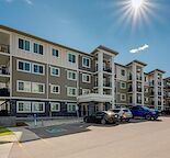 Top floor 2 bed/2 bath condo with in suite laundry, AC & underground parking.