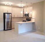 Bright Top Floor 2-bedroom Condo with 2 PARKING STALLS