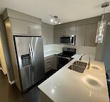 Modern + Bright TOP FLOOR Condo with a view!