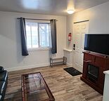 Quiet 1 bedroom basement suite with living room and storage