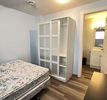 Shared furnished walk-out basement one-bedroom suite in Shawnessy