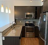 1 Bedroom + 1 large Den condo, oversized underground Parking