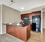 1 BEDROOM PLUS DEN WALKING DISTANCE TO LRT AND SHOPPING CENTER