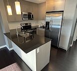 2 bedroom, top floor, modern clean condo located in Skyview