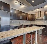 Top Floor Quiet 2 bed 1 bath unit w/parking next to Sait, C-Train and North Hill