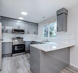 "Modern Oasis: Fully Renovated Townhouse Near LRT and Downtown!"