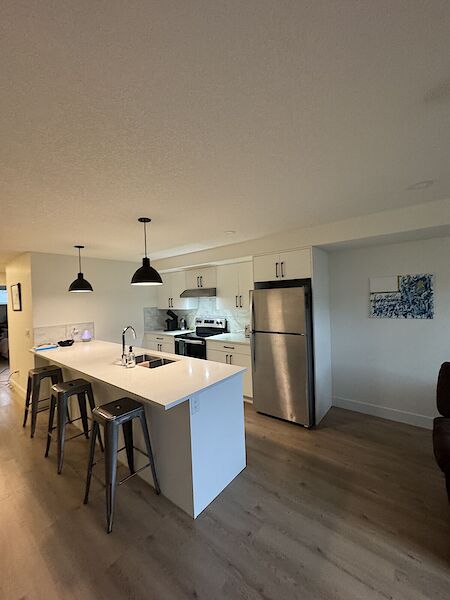 Two-Bedroom Basement Unit ~ Room Available
