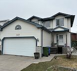 Harvest Hills 1 Bedroom + 1 Den Basement suite