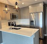 TOP FLOOR ONE BEDROOM + DEN - UNFURNISHED