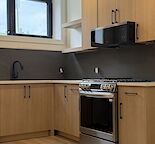 Wow, bright new lower suite - high end finishings - gas stove
