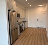 NEW HOME - Newly built, top floor, pet frienly, with titled parking, storage, AC