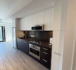 Brand-New 1 Bed + Den Condo with Balcony, Storage & City Views