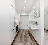 Immaculate Modern 1 Bed Condo with heated parking. Deck overlooking the Garden