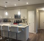 2 Bed + Den/Studio | 2 Bath | 1,158 sq ft | New Brighton SE | Underground Parkin