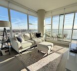 SE Corner 2-Bed with Stampede Views | A/C + Upgraded Gym I Unfurnished