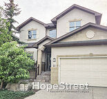 Executive Family Home in Cougar Ridge with Finished Basement