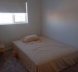 Cozy private bedroom room in shared space with shared washroom