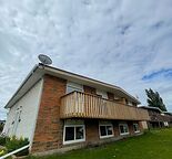 Spacious 3-Bed Main Floor Unit with Private Balcony & In-Suite Laundry