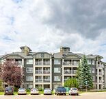 SPACIOUS TOP FLOOR 1 BEDROOM BACKING ONTO GREEN SPACE WITH UNDERGROUND PARKING
