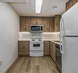 Renovated 2 Bedroom LEGAL Suite comes w/ a LARGE STORAGE shed & Shared laundry