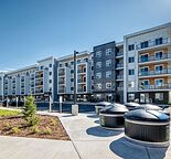 BRAND NEW 2 Bed / 2 Bath Condo in Wolf Willow | Gym, EV Charging, Heated Parking