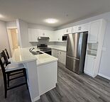 Updated Main-Floor 2-Bedroom Condo with A/C, In-Suite Laundry, Parking & Storage