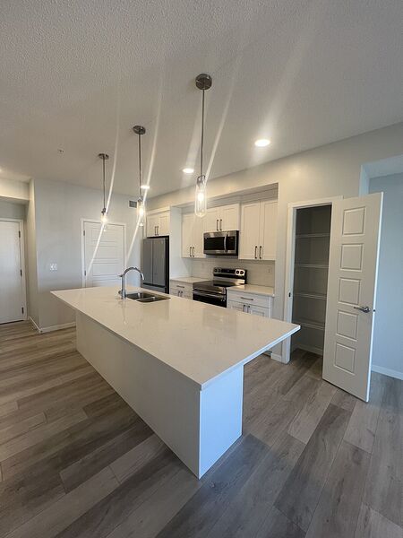 CARRINGTON PLACE - TWO BED CONDO WITH UG PARKING AND STORAGE LOCKER