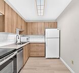 Beautifully Renovated 2-Bedroom Condo | Walk to LRT & Southcentre Mall |