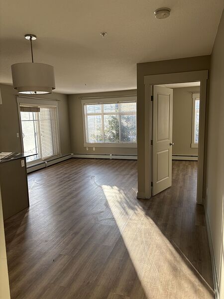 Sunny two bedrooms two bathrooms condo, new flooring, paint and dishwasher.