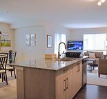 FULLY FURNISHED 2 bedroom + den, 2 bath corner unit in NE Calgary