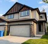 Spacious Duplex with Walk-Out Basement in Springbank Hills