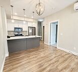 Bright & Spacious TOP FLOOR (Air conditioned) 1-Bedroom + Den Condo