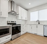 Main Floor Legalized Unit in Modern Townhome in Sage Hill with Double Garage!