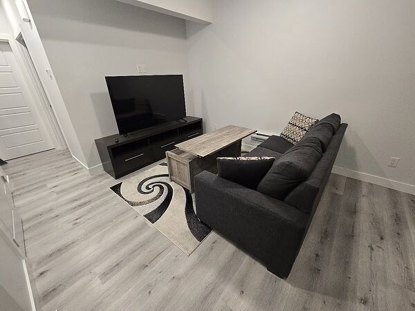Furnished 1 Bed + Den Legal Basement Suite in Keswick – Utilities Included!