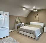 Luxury Fully Furnished Suite with Stunning Lake View in Prestigious Bearspaw
