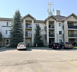 Main-level 1-Bedroom + Den Condo with Parking & Patio - $1,550/month