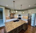 Executive Walkout Bungalow with Loft & Parkside Location in Evergreen