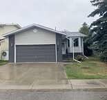 5 Bedroom, 3 Bathroom house with a Double Attached Garage  and a Fenced Backyard
