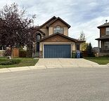 Executive 4-Bedroom Walkout Home with Downtown Views, Finished Basement & Double Garage in Springbank Hill
