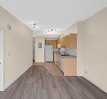 Bright East-Facing Unit  (Utilities and Heated Parking Included)